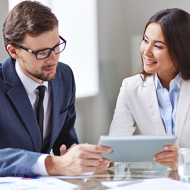 Business professionals reviewing documents